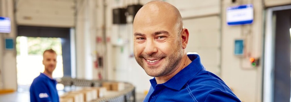 GLS driver smiling at the camera