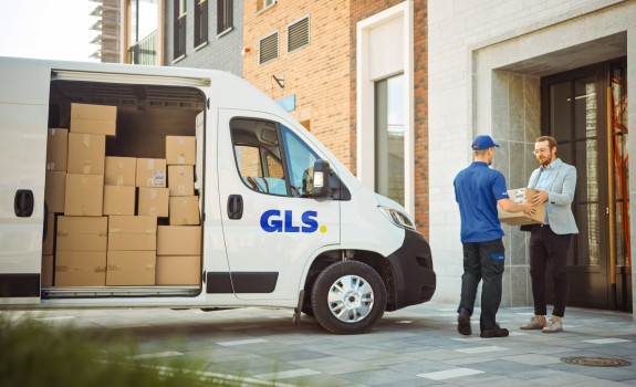 GLS driver picking up a package at a customer